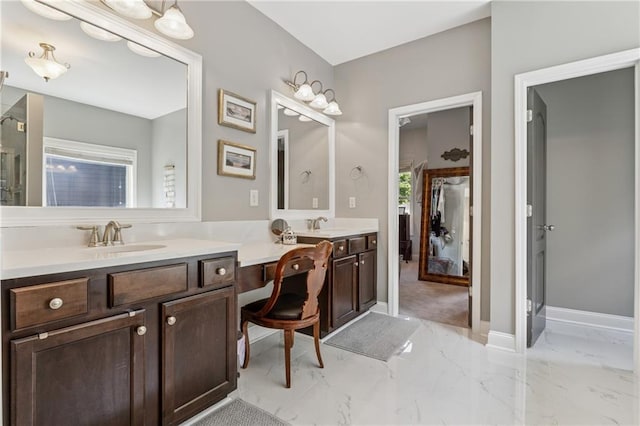 full bath featuring double vanity, marble finish floors, a shower with door, and baseboards