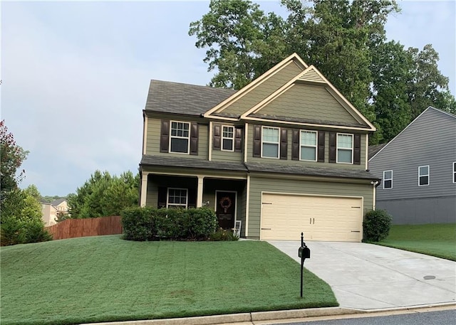 view of front facade with a garage and a front lawn