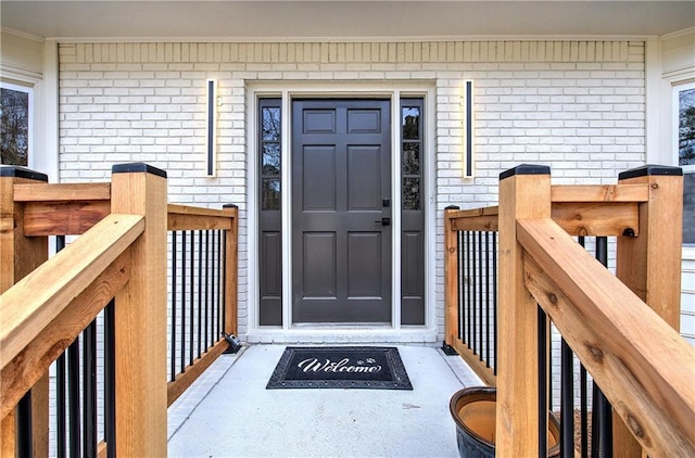 entrance to property with brick siding