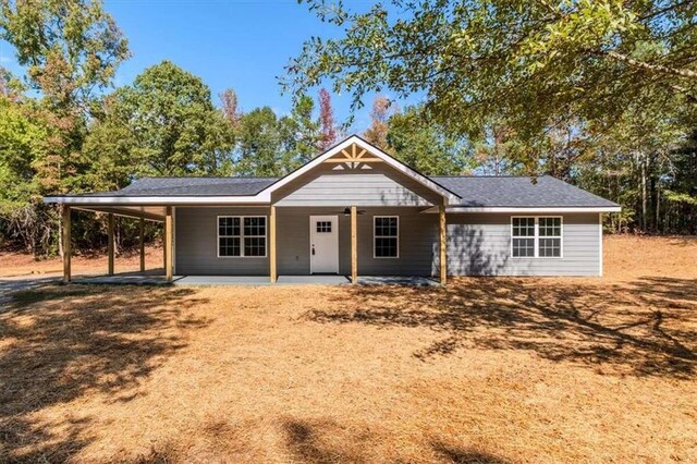 ranch-style house with a carport