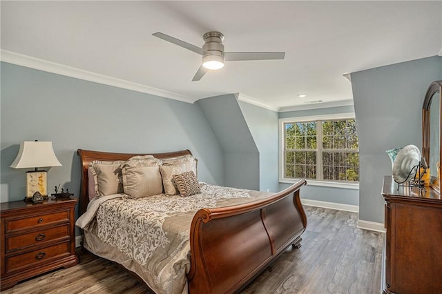 bedroom with ornamental molding, ceiling fan, and dark wood-type flooring