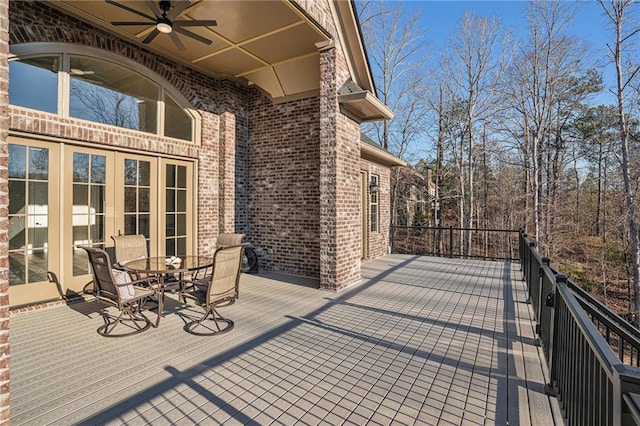 wooden deck featuring ceiling fan