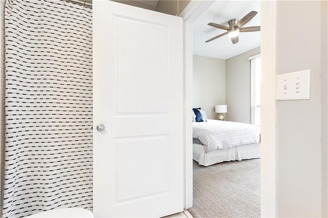 carpeted bedroom with ceiling fan