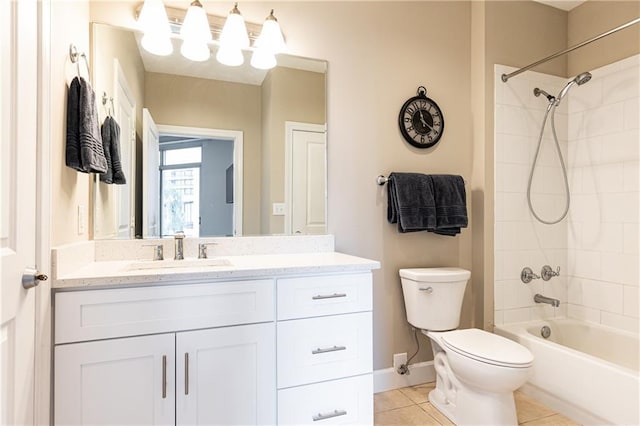 full bathroom with toilet, vanity, tiled shower / bath, and tile patterned flooring