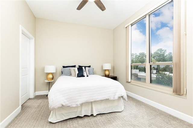 carpeted bedroom featuring ceiling fan