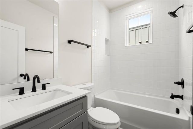 bathroom featuring toilet, shower / washtub combination, and vanity