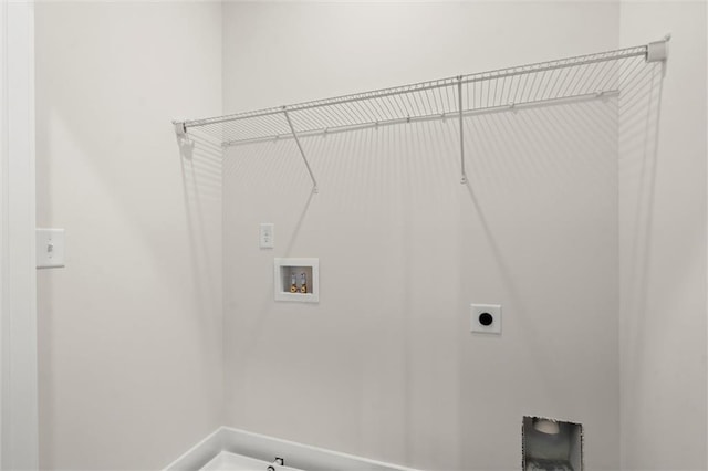 clothes washing area featuring electric dryer hookup, laundry area, and hookup for a washing machine