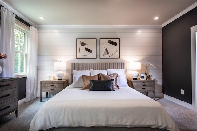 bedroom featuring light colored carpet, ornamental molding, and multiple windows