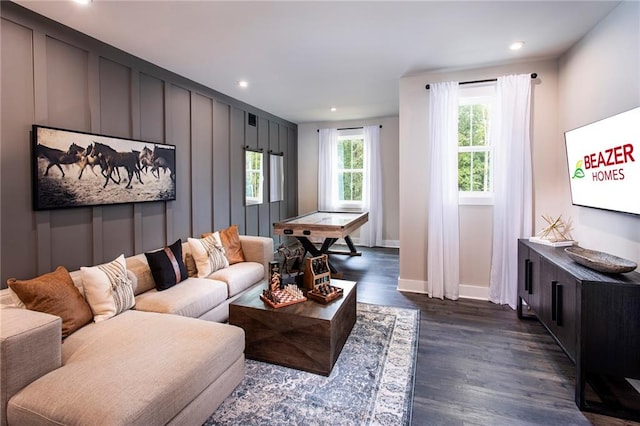 living room with dark hardwood / wood-style flooring