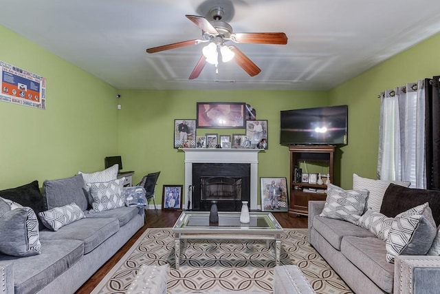 living room with ceiling fan and wood-type flooring