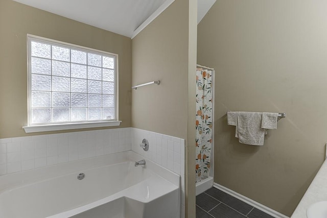 bathroom featuring vaulted ceiling, sink, tile patterned floors, and shower with separate bathtub