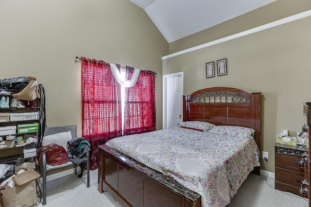 bedroom with light carpet and lofted ceiling