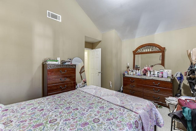 bedroom with lofted ceiling and carpet flooring