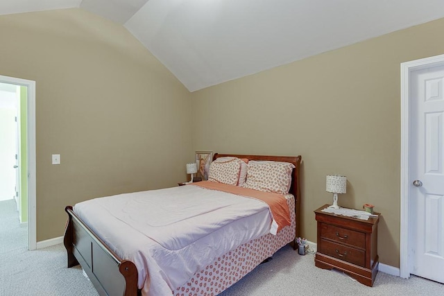 carpeted bedroom featuring vaulted ceiling