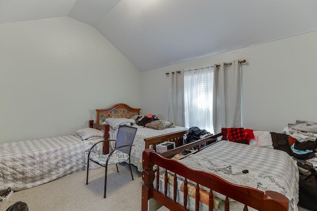 bedroom featuring carpet and lofted ceiling