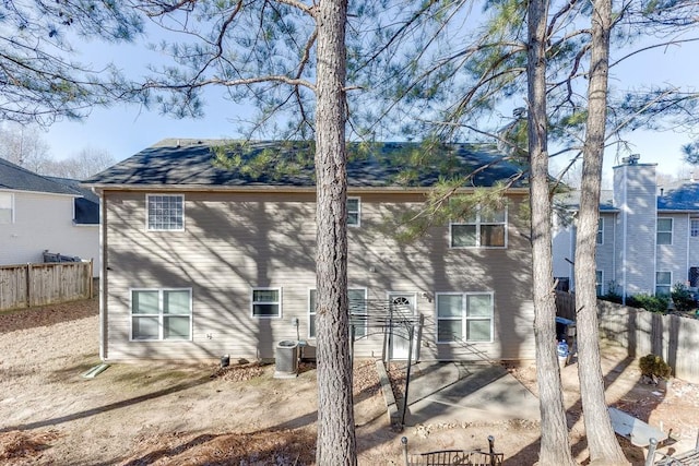 rear view of house featuring cooling unit and a patio