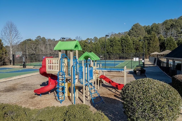 view of playground with tennis court and basketball court