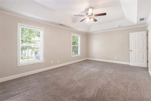 5712 Grande River Rd, Atlanta, GA 30349 - spare room with a raised ceiling, ornamental molding, ceiling fan, baseboards, and carpet