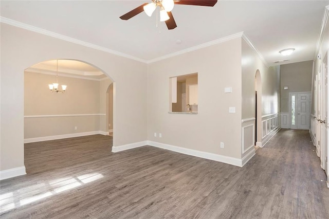 5712 Grande River Rd, Atlanta, GA 30349 - empty room with a ceiling fan, wood finished floors, crown molding, baseboards, and arched walkways