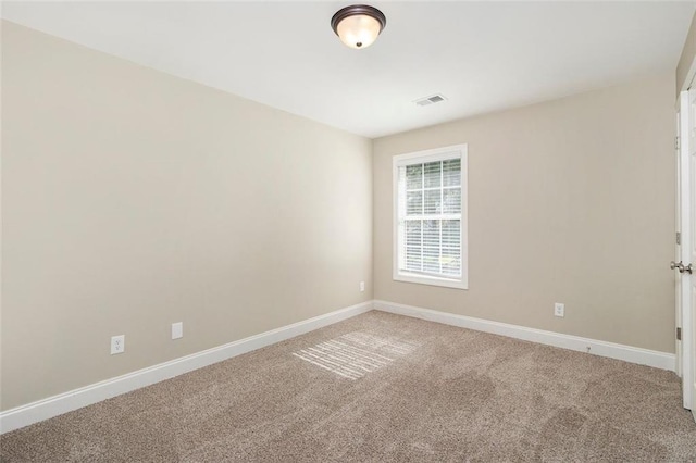 5712 Grande River Rd, Atlanta, GA 30349 - empty room with light colored carpet and baseboards