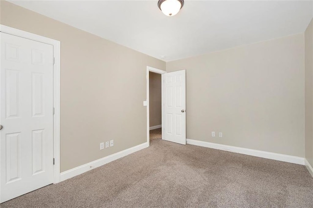 5712 Grande River Rd, Atlanta, GA 30349 - unfurnished bedroom with carpet flooring and baseboards
