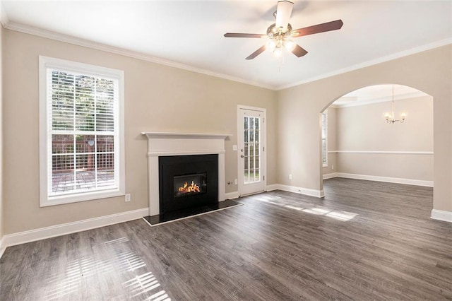 5712 Grande River Rd, Atlanta, GA 30349 - unfurnished living room featuring baseboards, arched walkways, wood finished floors, a glass covered fireplace, and ornamental molding