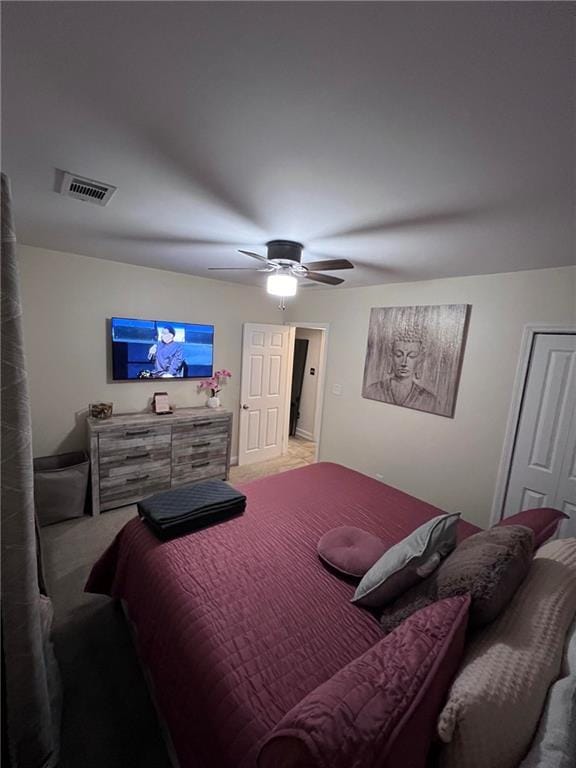 carpeted bedroom with ceiling fan