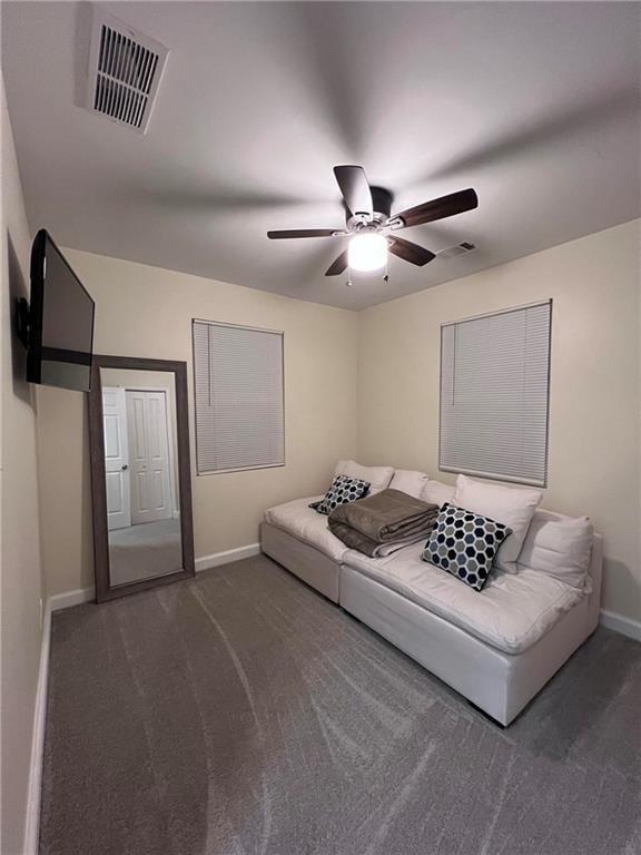 living room with dark carpet and ceiling fan