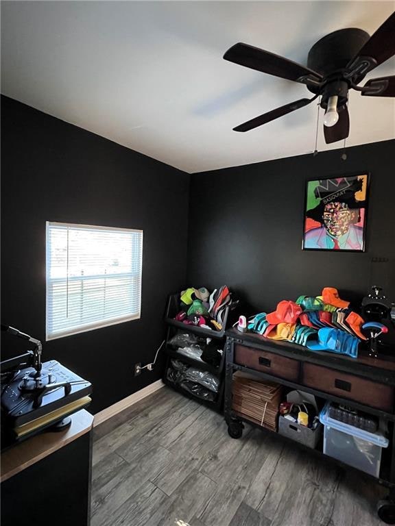 bedroom featuring ceiling fan and hardwood / wood-style floors