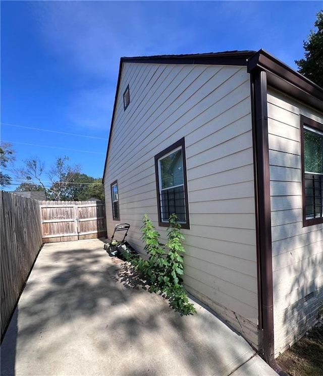 view of side of home featuring a patio