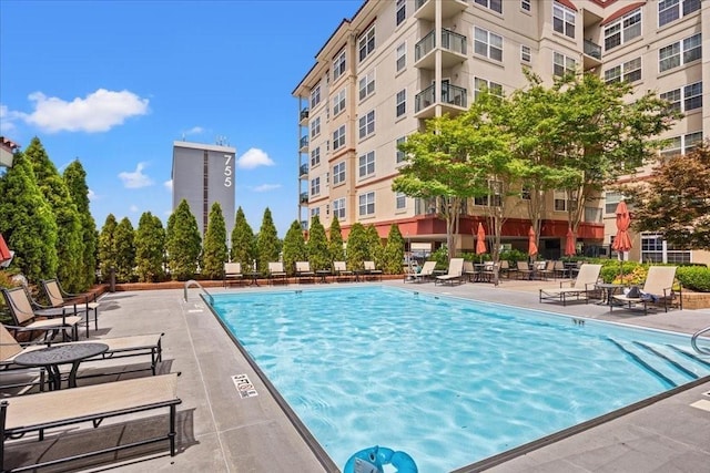 view of swimming pool featuring a patio area