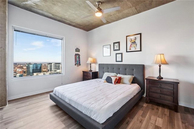 bedroom with hardwood / wood-style flooring and ceiling fan