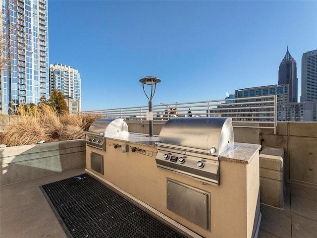 view of patio / terrace with an outdoor kitchen and area for grilling