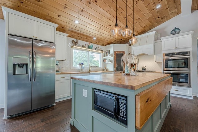 kitchen featuring appliances with stainless steel finishes, wooden counters, wooden ceiling, dark wood-style floors, and white cabinetry