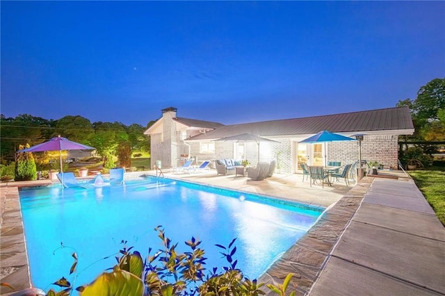 outdoor pool featuring a patio