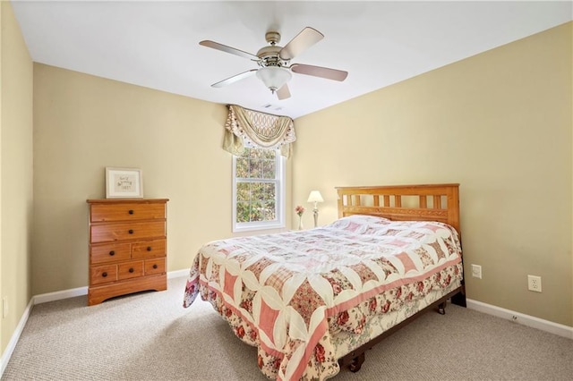 bedroom featuring light colored carpet and ceiling fan