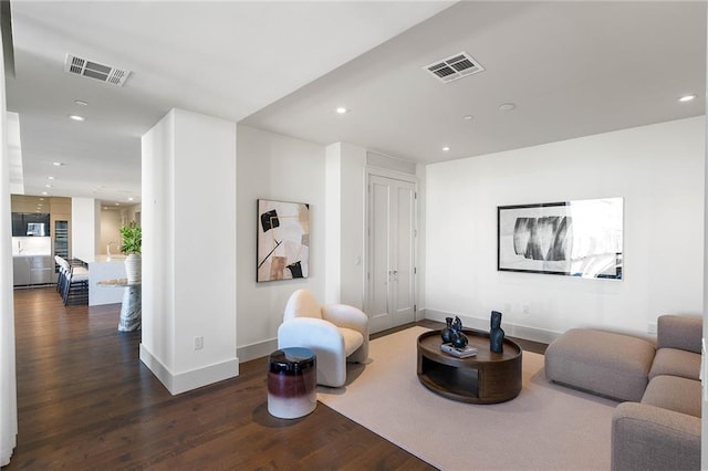 living room featuring dark hardwood / wood-style flooring