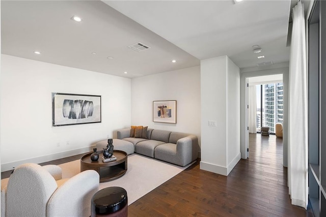 living room featuring dark hardwood / wood-style floors