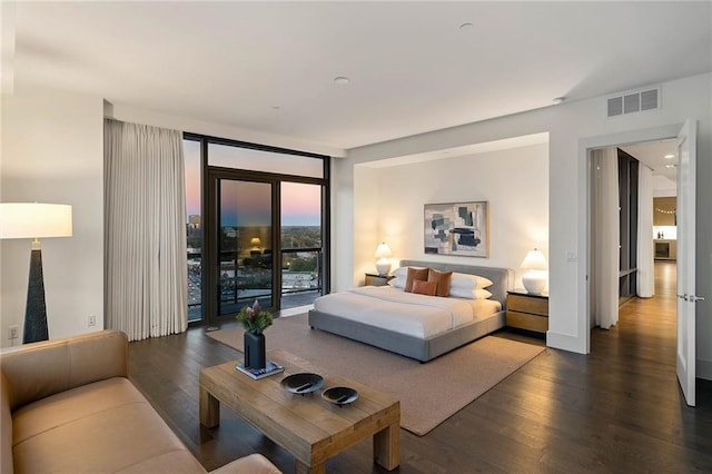 bedroom featuring access to outside, floor to ceiling windows, and dark hardwood / wood-style flooring