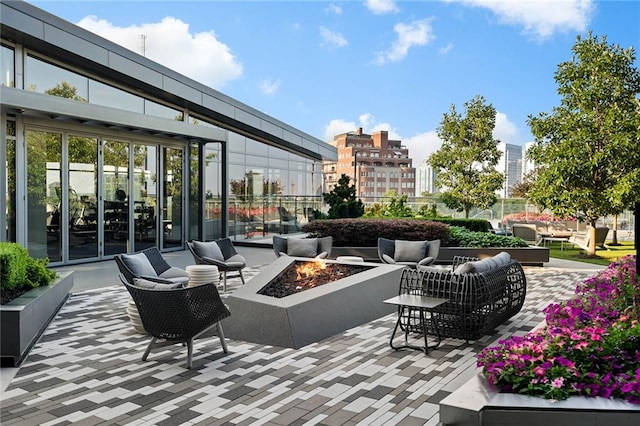 view of patio / terrace featuring an outdoor living space with a fire pit