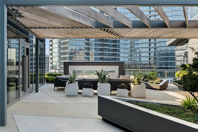 view of patio / terrace featuring an outdoor living space and a pergola