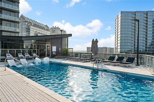 view of swimming pool featuring a patio area