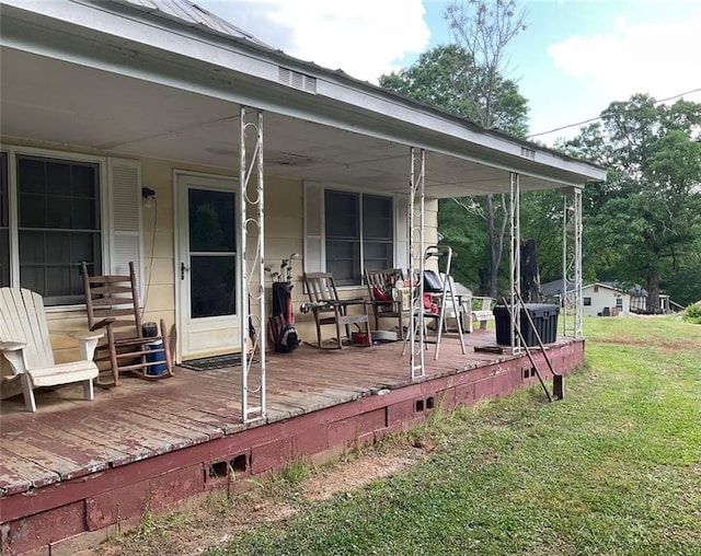 wooden terrace with a yard