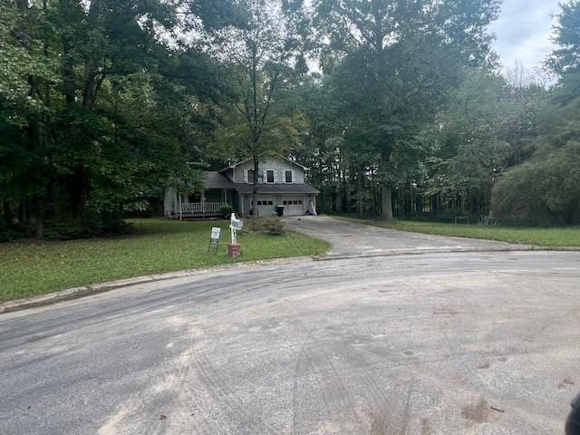 view of front facade featuring a front lawn and a garage