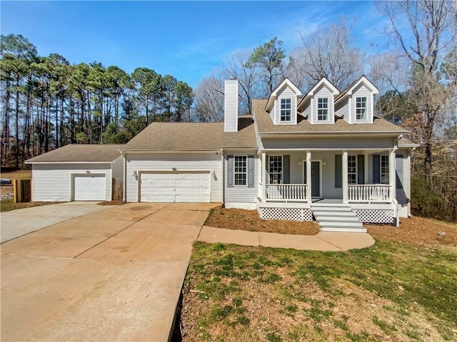 cape cod home featuring a chimney, covered porch, concrete driveway, and a garage