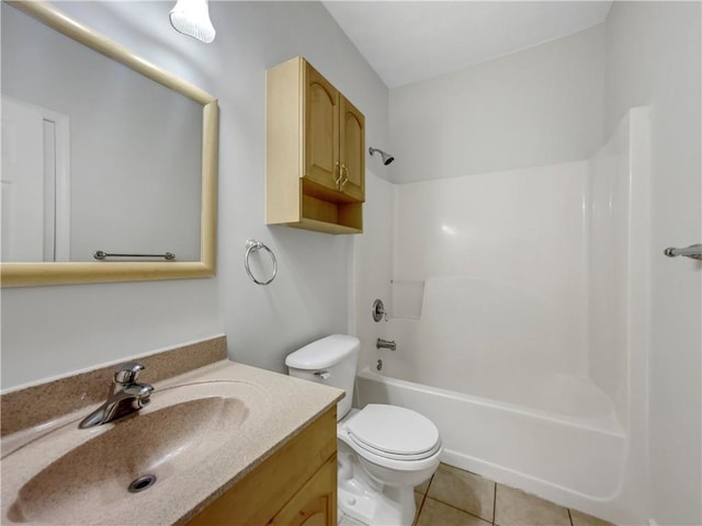 full bathroom featuring tile patterned floors, toilet, shower / washtub combination, and vanity