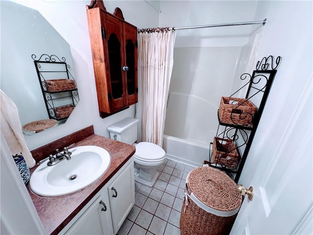 full bathroom featuring tile patterned flooring, shower / tub combo, vanity, and toilet