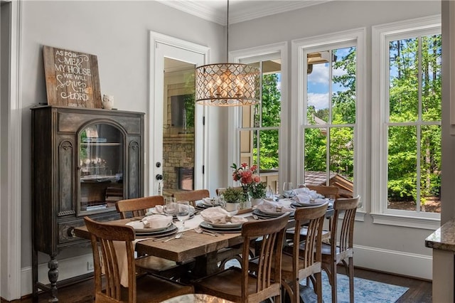 5330 Lake Redwine Cv NW, Acworth, GA 30101 - dining room with healthy amount of natural light, ornamental molding, dark wood finished floors, and baseboards