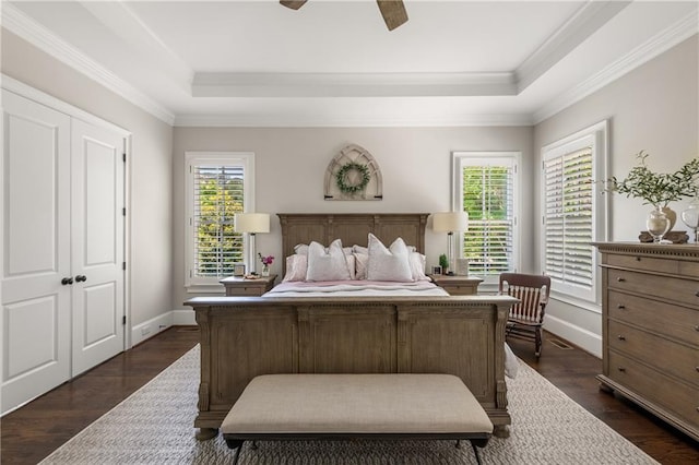 5330 Lake Redwine Cv NW, Acworth, GA 30101 - bedroom featuring a tray ceiling, baseboards, ornamental molding, dark wood-style flooring, and a ceiling fan
