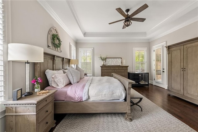 5330 Lake Redwine Cv NW, Acworth, GA 30101 - bedroom featuring multiple windows, dark wood finished floors, a raised ceiling, ornamental molding, and a ceiling fan